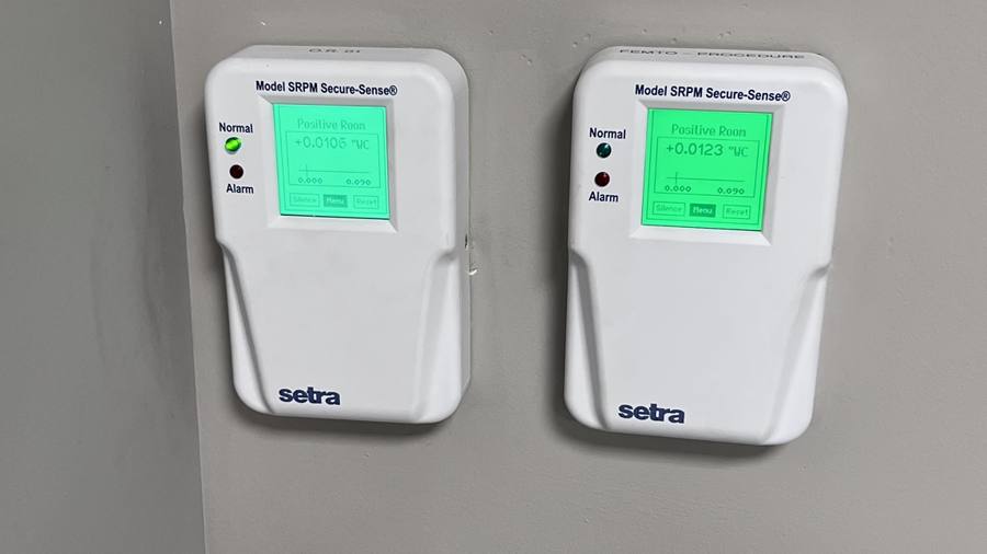 Room pressure monitors showing positive pressure