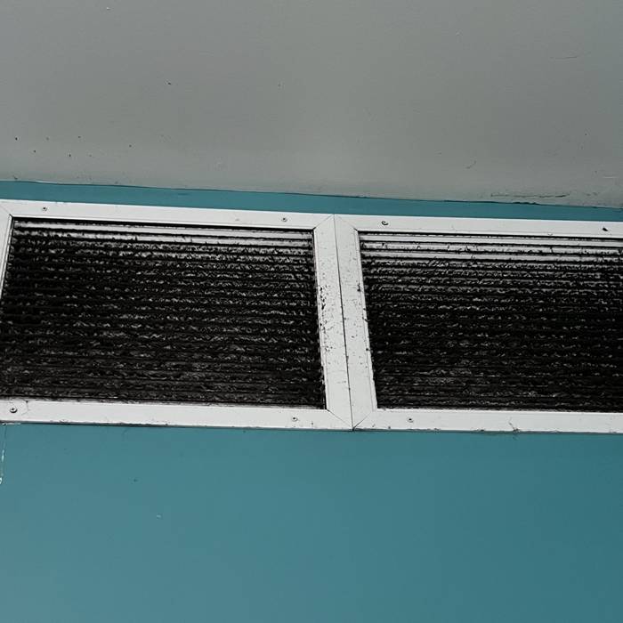 Return grilles caked with dust