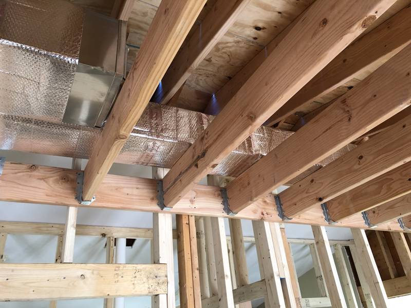 Insulated supply trunk run between the joists