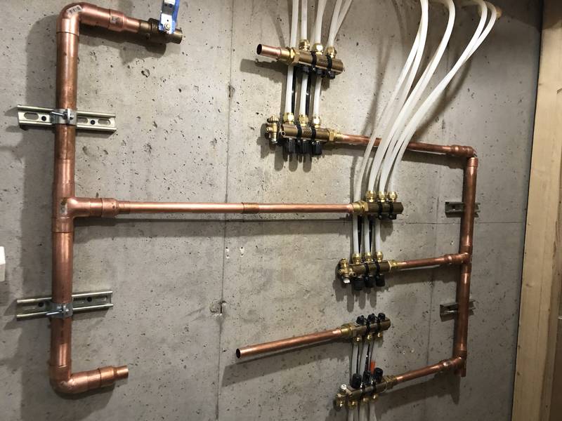 Copper headers feeding radiant floor manifolds