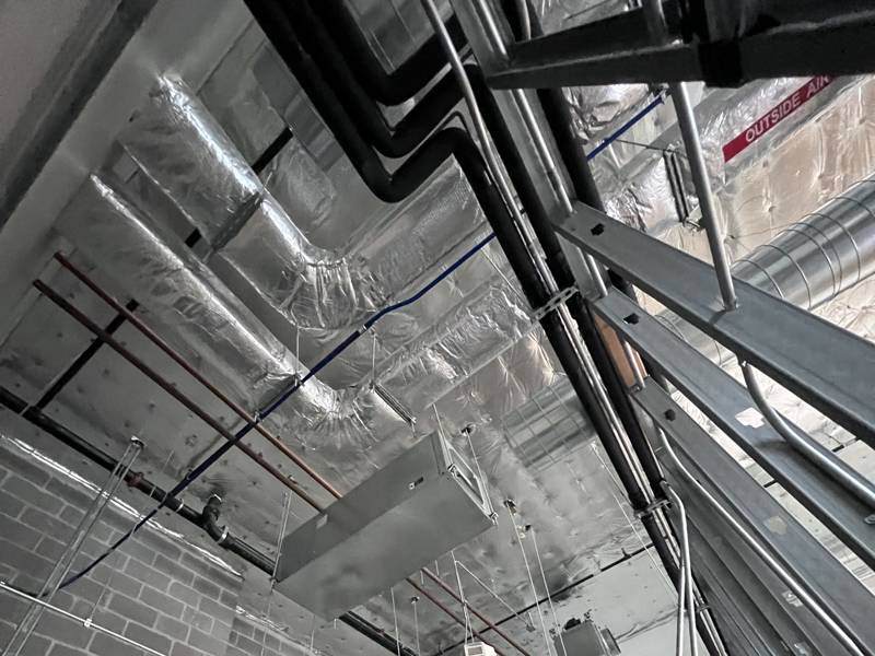 Insulated duct and fan coil in a tenant buildout