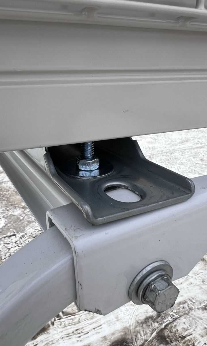 Unit feet bolted to the stand rails